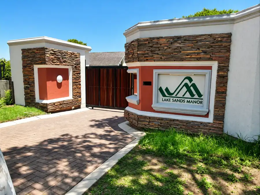 Entrance gate and Lake Sands Manor sign
